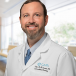 headshot of Edgar D. St. Amour, M.D.